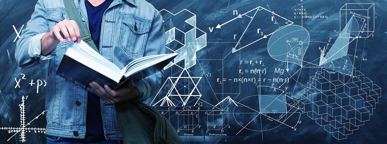 Man studying on a book with mathematical equations